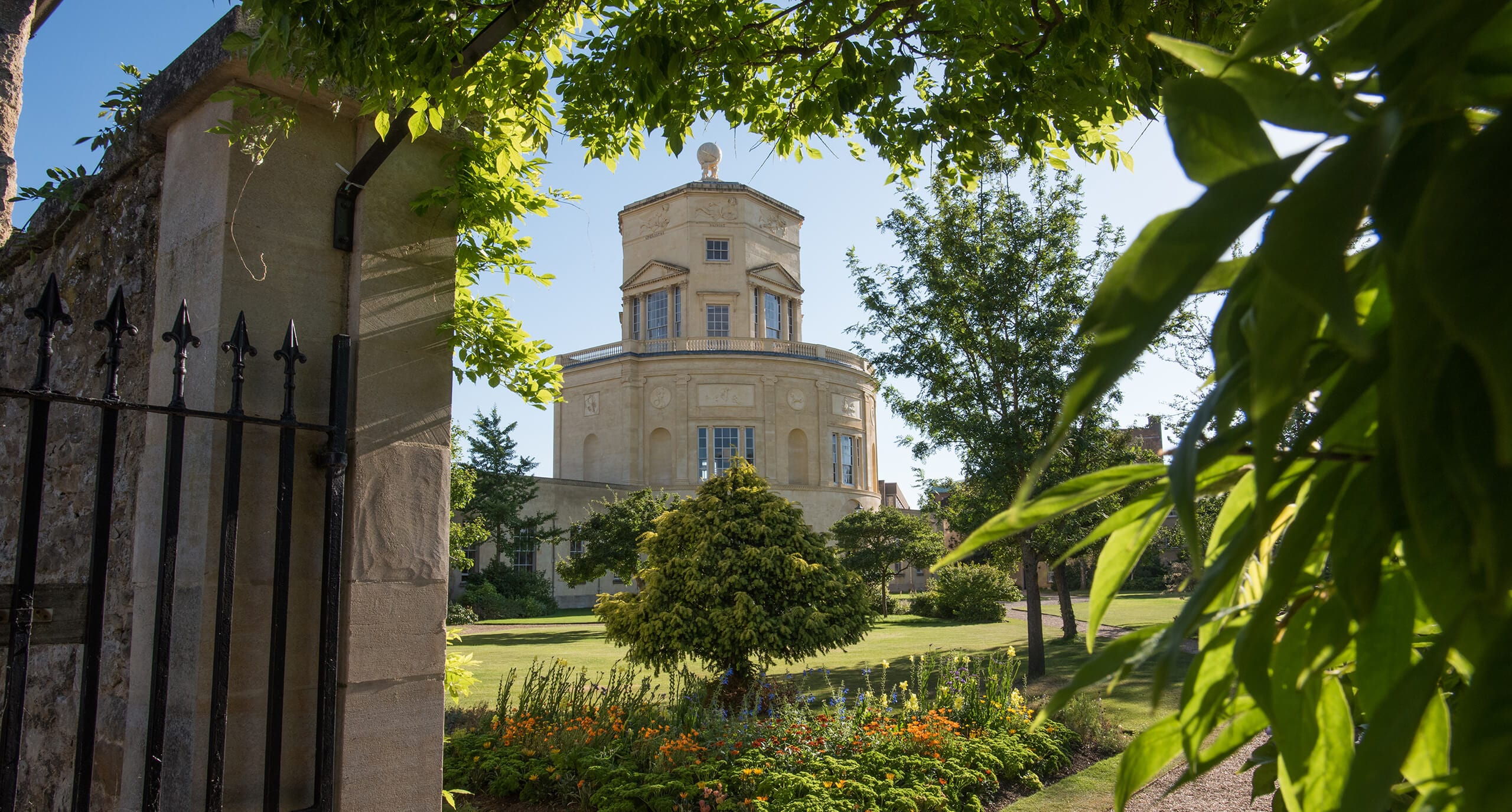 The Radcliffe Observatory seen through a leaf-covered archway