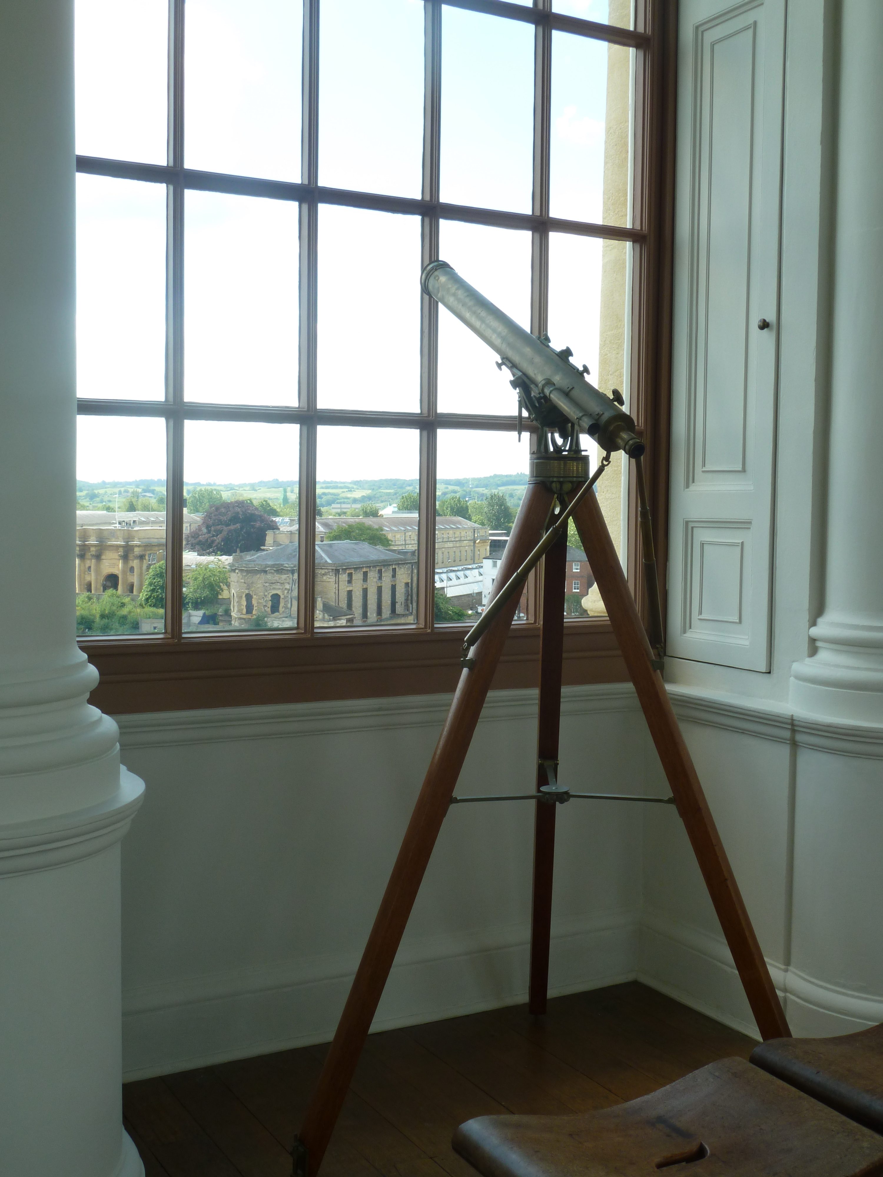 The Duke of Marlborough Telescope positioned against a window in the Tower of the Winds overlooking Jericho 