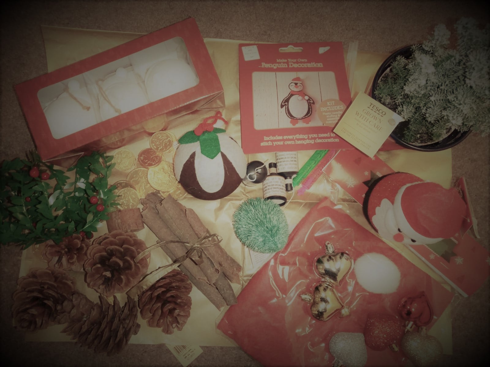 Various Christmas decorations including tree ornaments, pine cones and chocolate coins