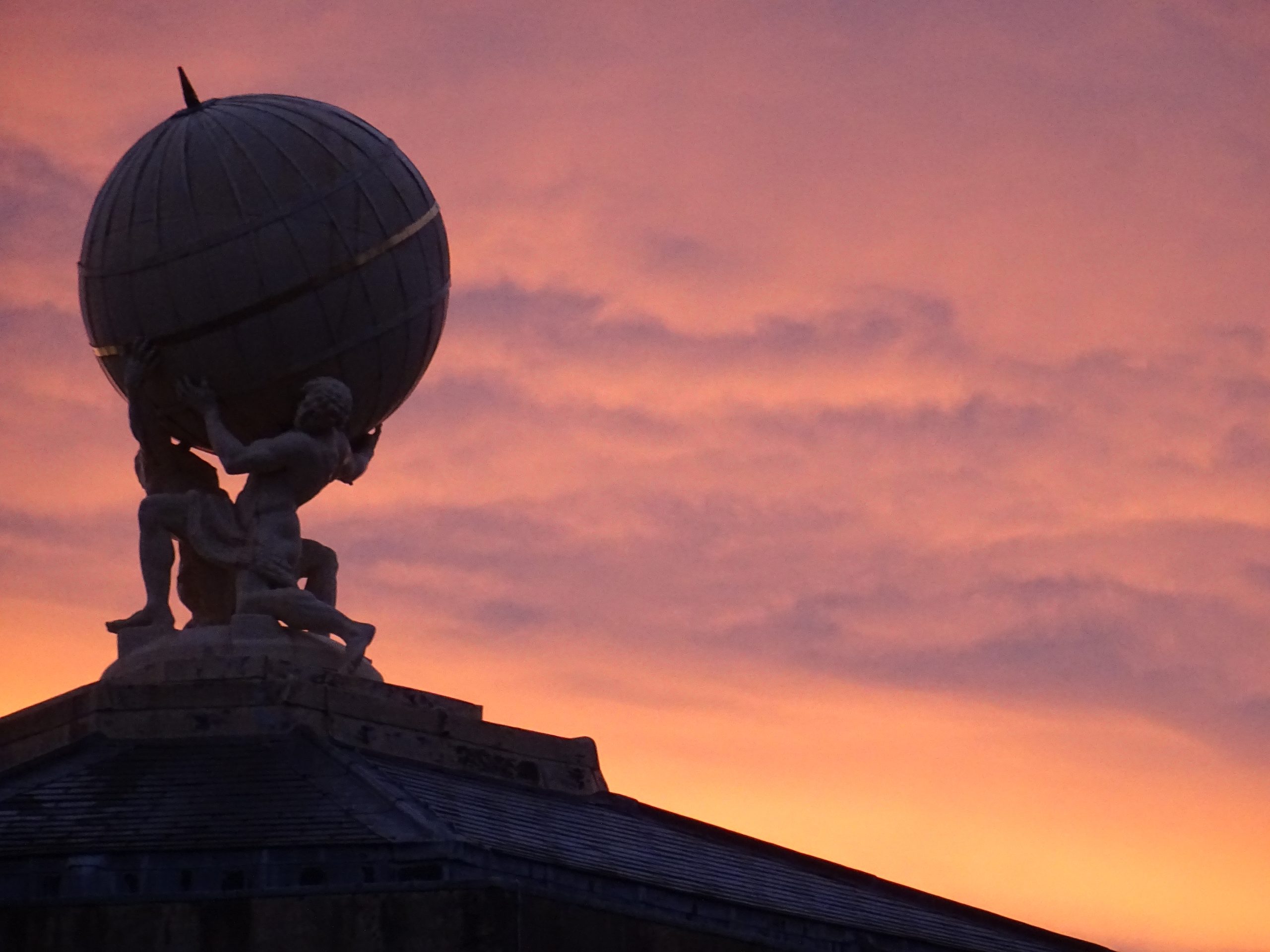 The globe on top of the Radcliffe Observatory's Tower of the Winds with an orange sunset in the background