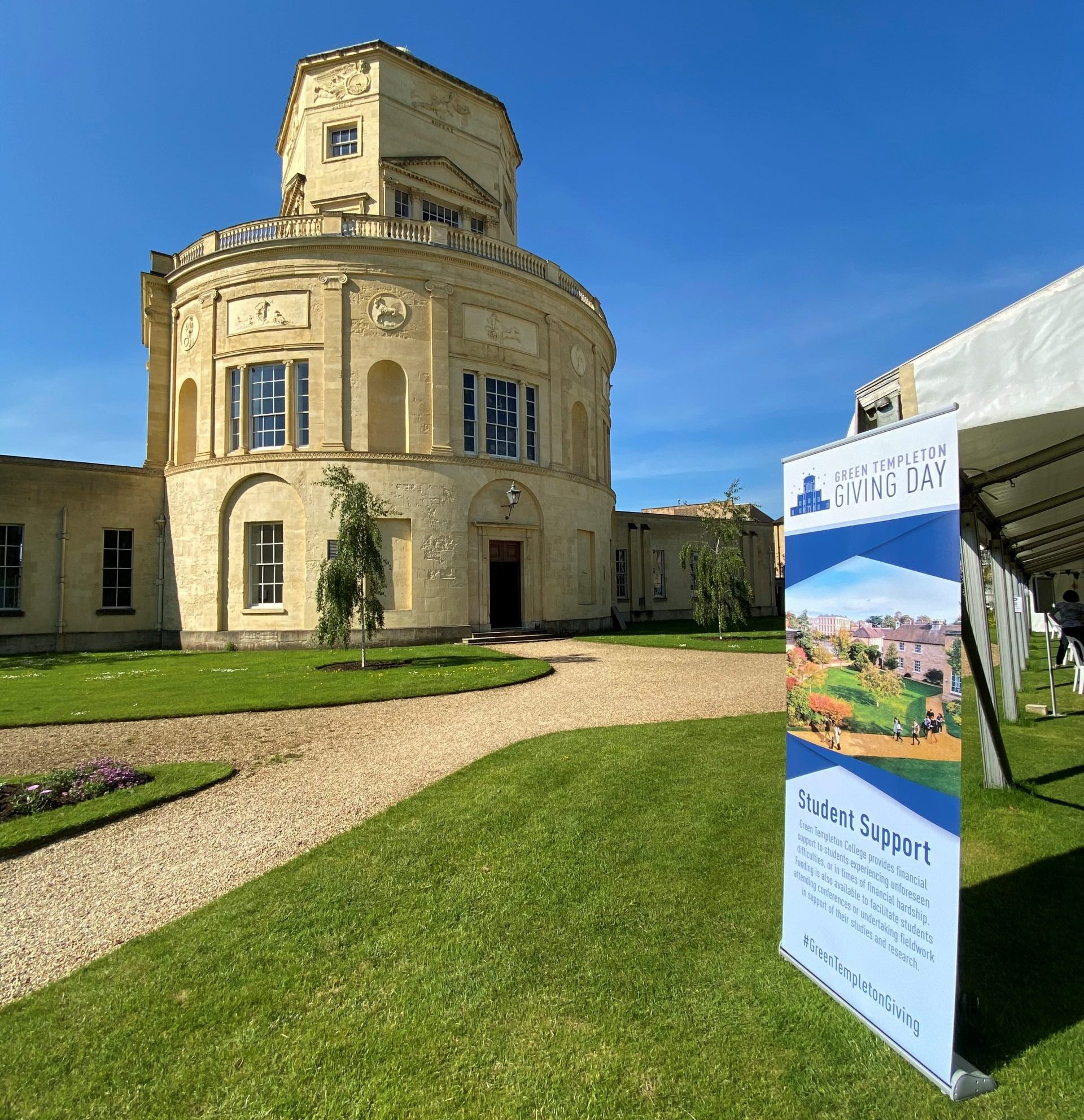 A banner displaying the words 'Green Templeton Giving Day' and 'Student Support' hangs in front of the Radcliffe Observatory