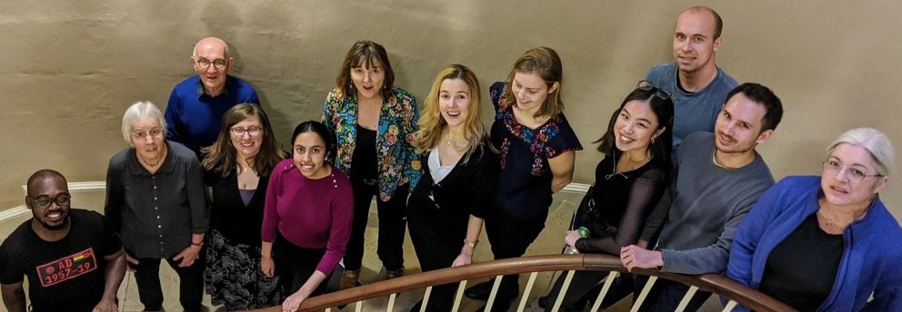 Members of the GTC Community Choir stand on the steps leading to the Tower of the Winds