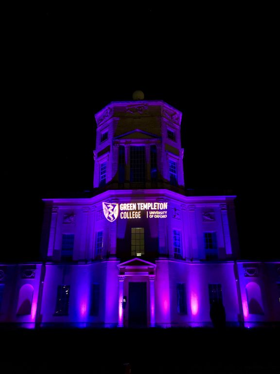 Radcliffe Observatory lit purple from frontwith Green Templeton logo projected