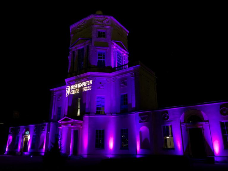Radcliffe Observatory lit purple with Green Templeton logo projected