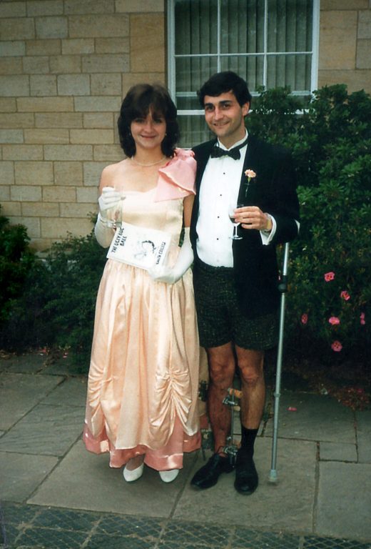 Laurence Leaver with crutches in dinner jaket and black tie with shorts With Fiona Cullington