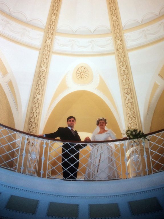 Laurence Leaver With Wife Ro in wedding attire on balcony in Observatory Tower Room