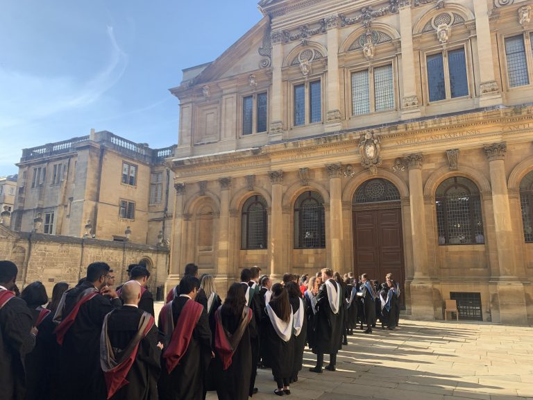 Graduates in gowns ready to enter Sheldonian Theatre