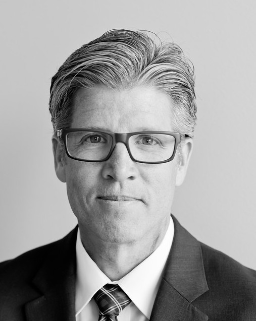 Black And White headshot in suit and tie
