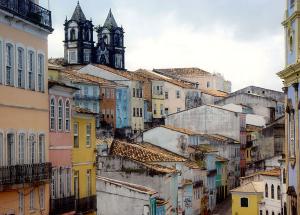 View of colourful rooftops in a city against a cloudy sky
