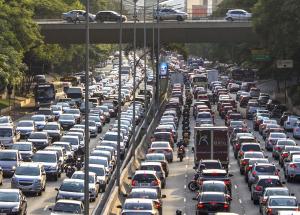 A traffic jam of cars and lorries on a three-lane motorway