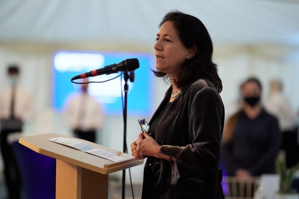Rebecca Surender Talking At lectern with mic prominent
