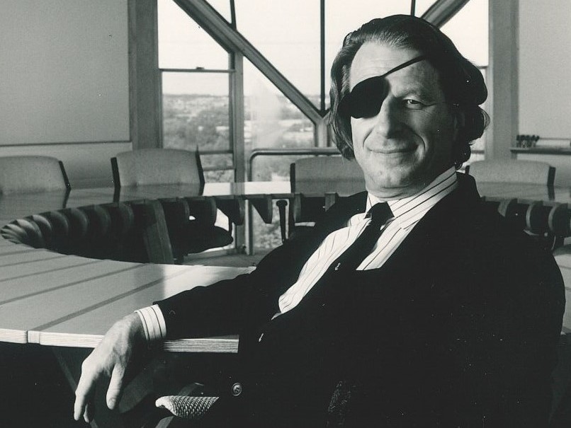 Uwe Kitzinger seated in boardroom