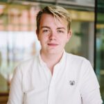 Alexander Hasson in white shirt