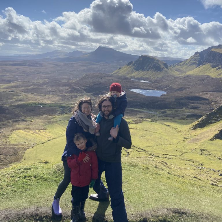 Stephanie Walton and family on top of a rolling valley
