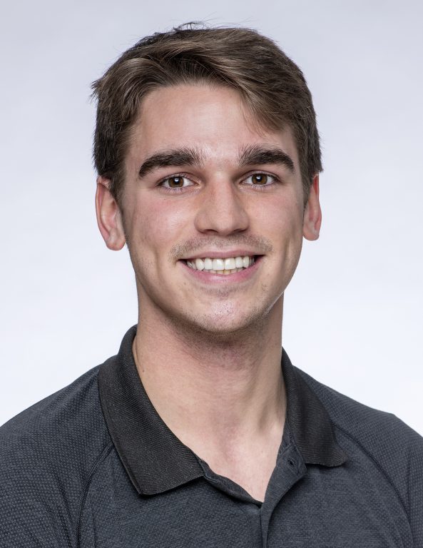 Craig Decker wearing black polo shirt