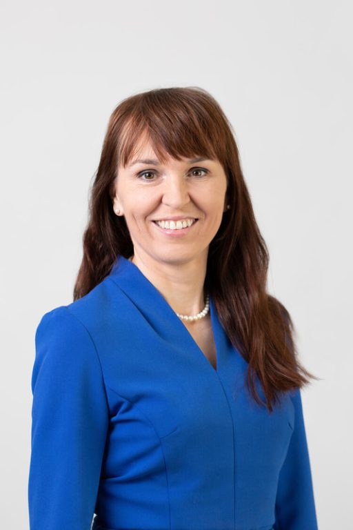 Malgorzata Wamil headshot wearing blue suit 
