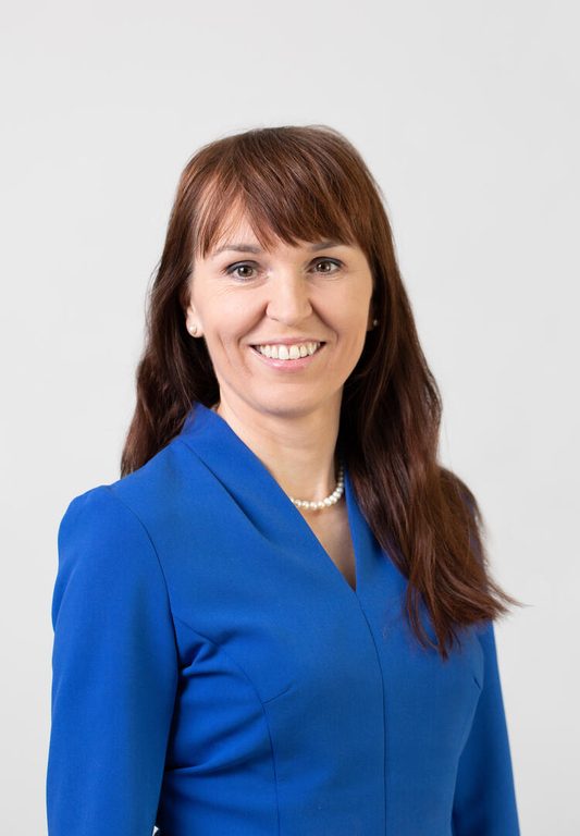 Malgorzata Wamil headshot wearing blue suit