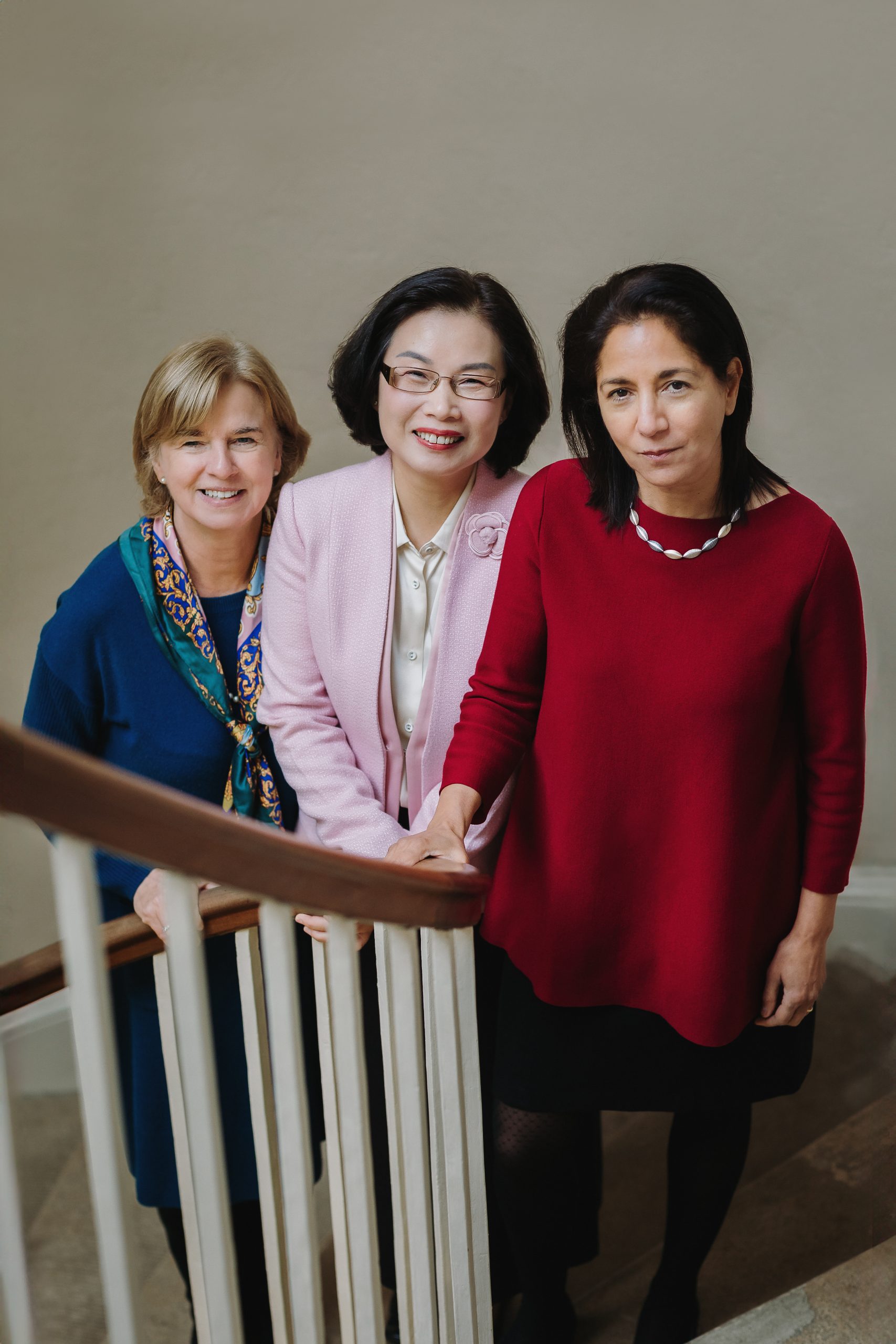 Professor Sue Dopson, Professor Xiaolan Fu, Professor Rebecca Surender stood on stairs of the Radcliffe Observatory looking at the camera 