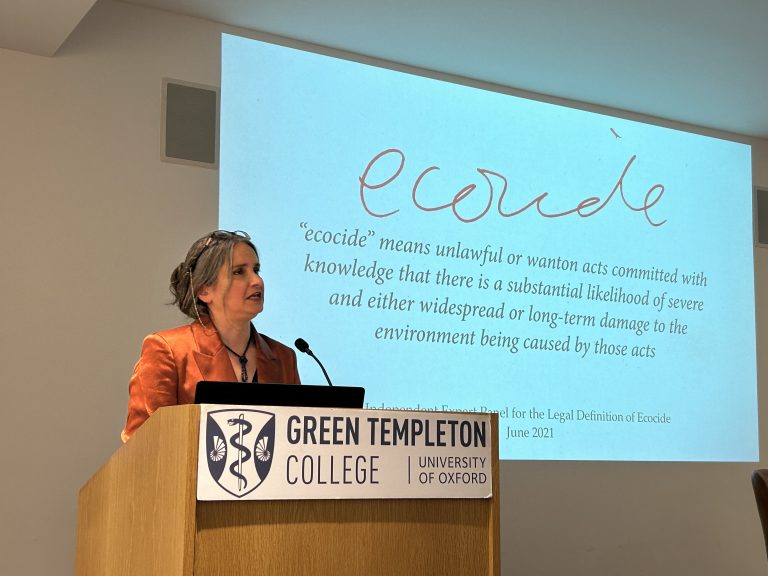 Jojo Metha speaking at Lectern 