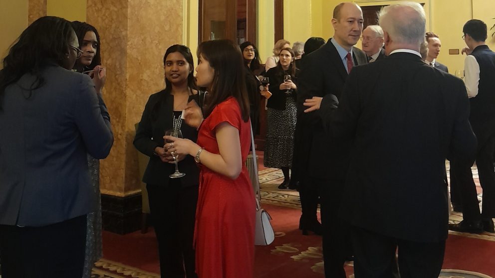 Guests Mingling At Reception In Ornate Room At Oxford And Cambridge Club