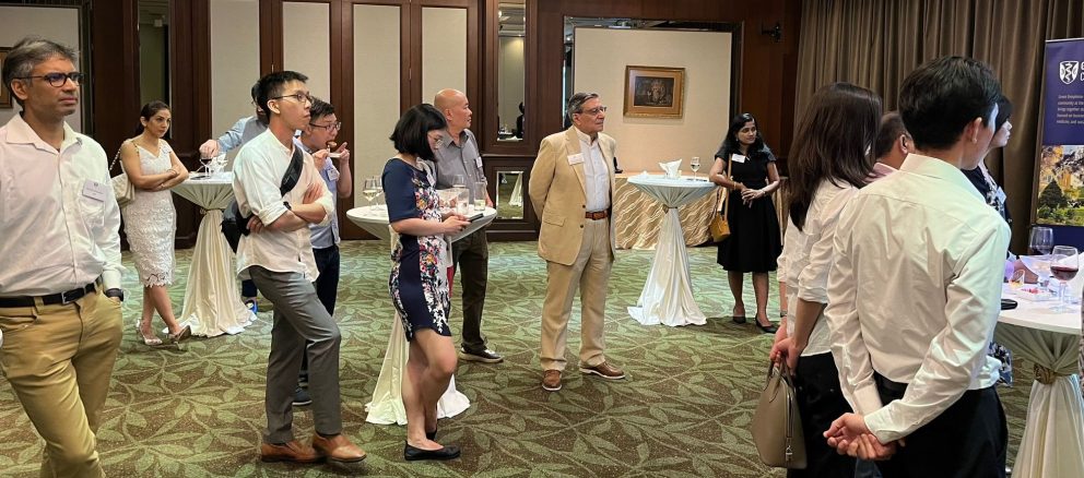 Alumni Listening To Principal Sir Michael Dixon In Singapore