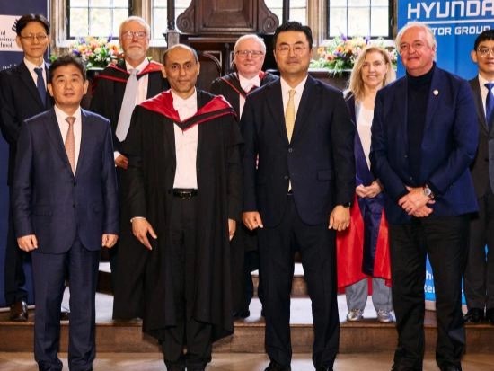 9 individuals in formal dress at Oxford Hyundai Motor Group Foresight Centre Launch