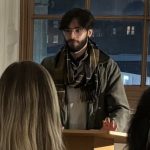 Reef Ronel Addressing Guests At Lectern