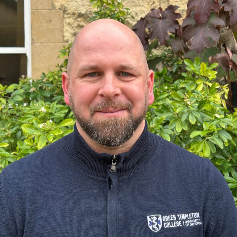 Jamie Brooks in front of greenry