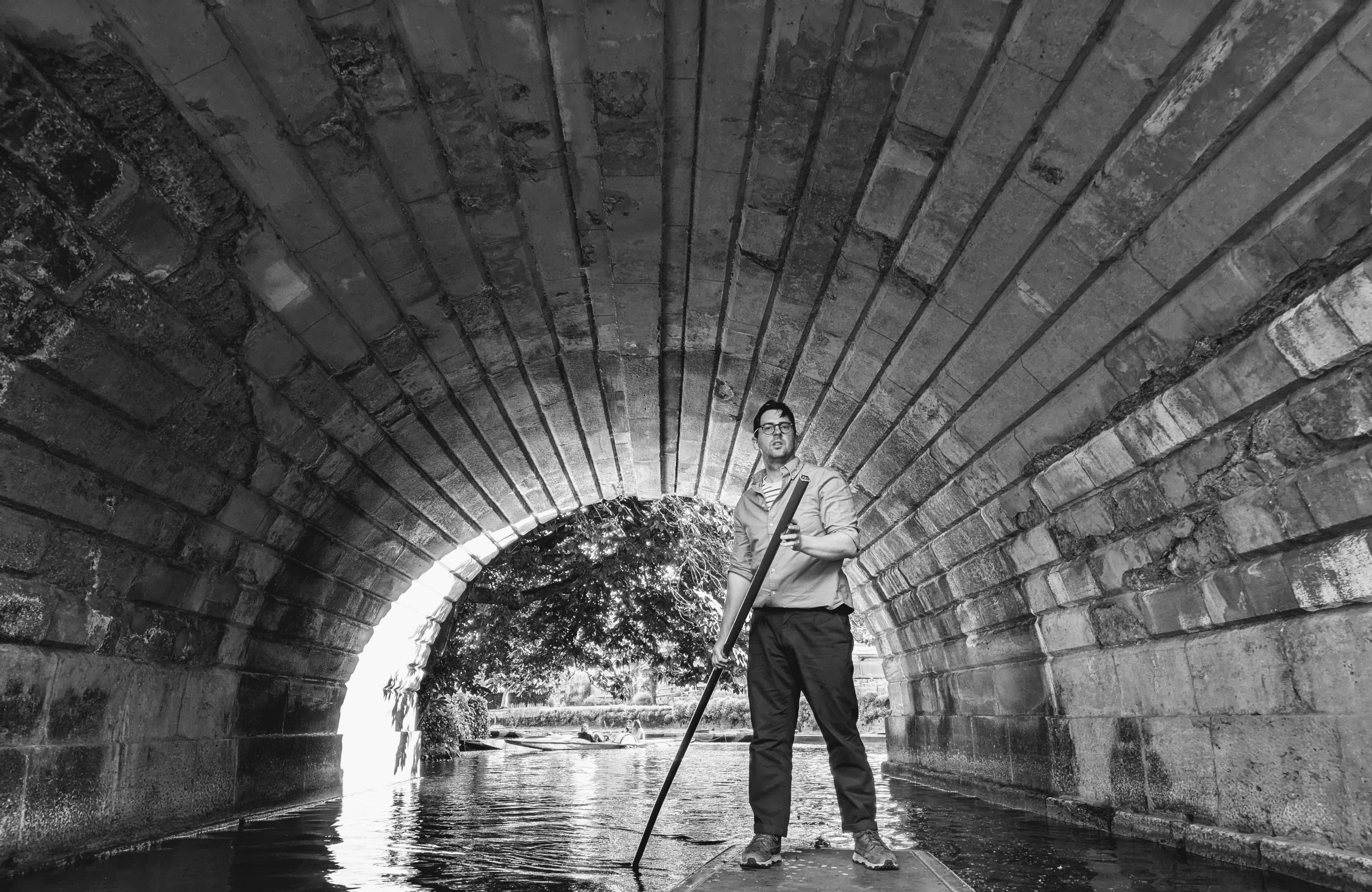 A punt passing under a bridge