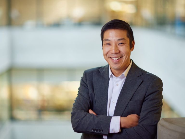 Lennard Lee Profile Pic smiling in shirt and jacket