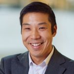 Lennard Lee Profile Pic in shirt and jacket smiling