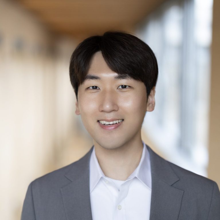 Kyeyoung Shin wearing grey suit and white shirt