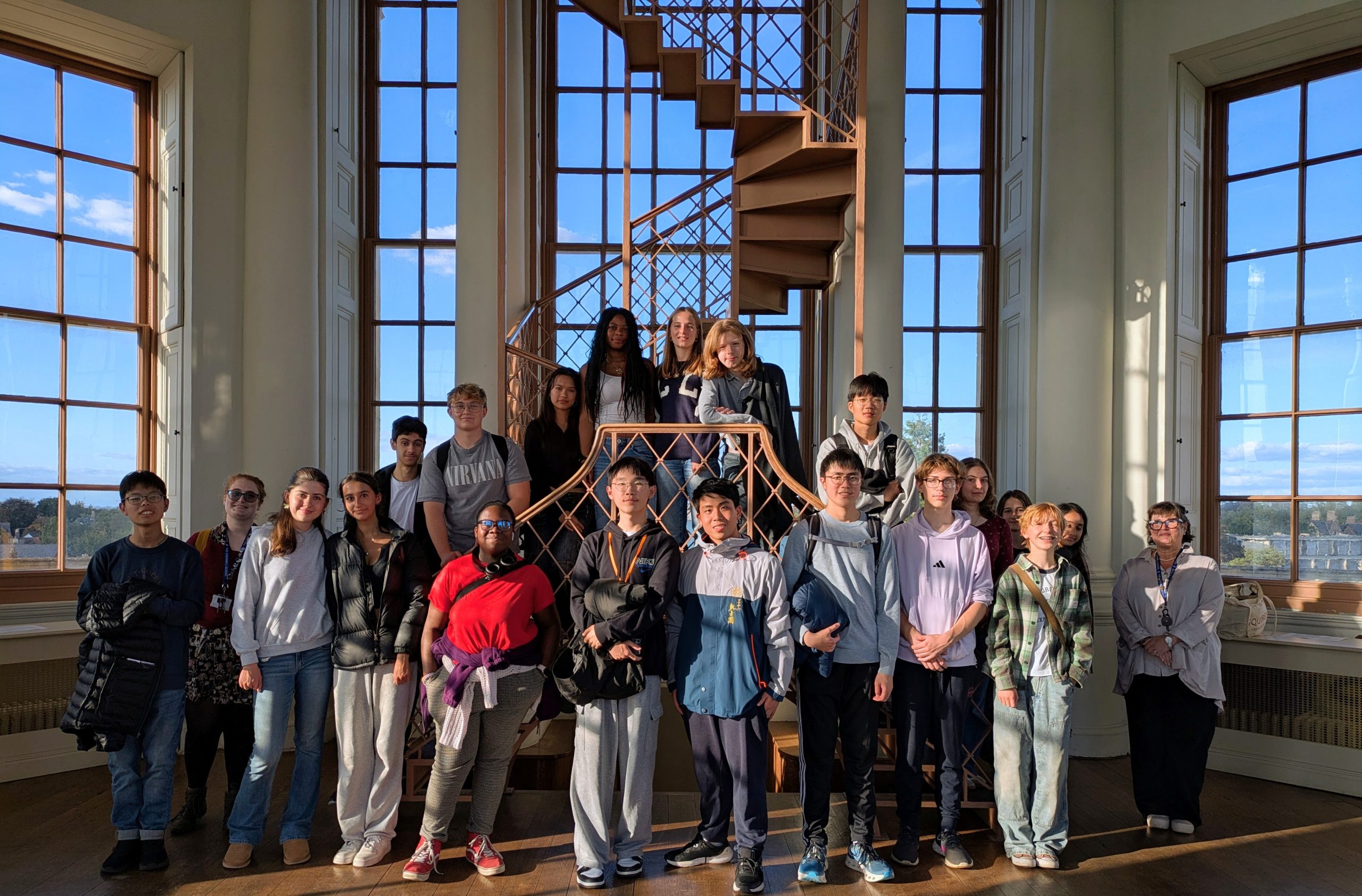 Cherwell School students lined up in front of the large windows of the Radcliffe Observatory
