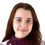 Diana Adamo smiling at camera in front of white background