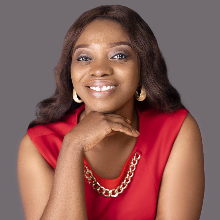 Pelumi Olugbile Smiling Resting Chin On Hand