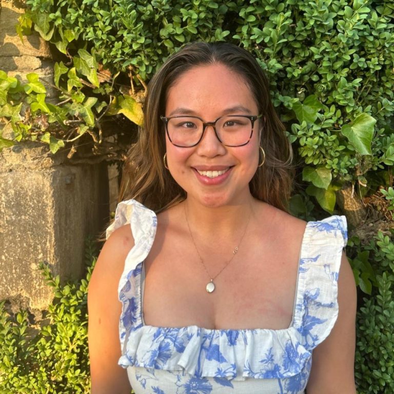 Michelle Yeung stood in front of green brushes 