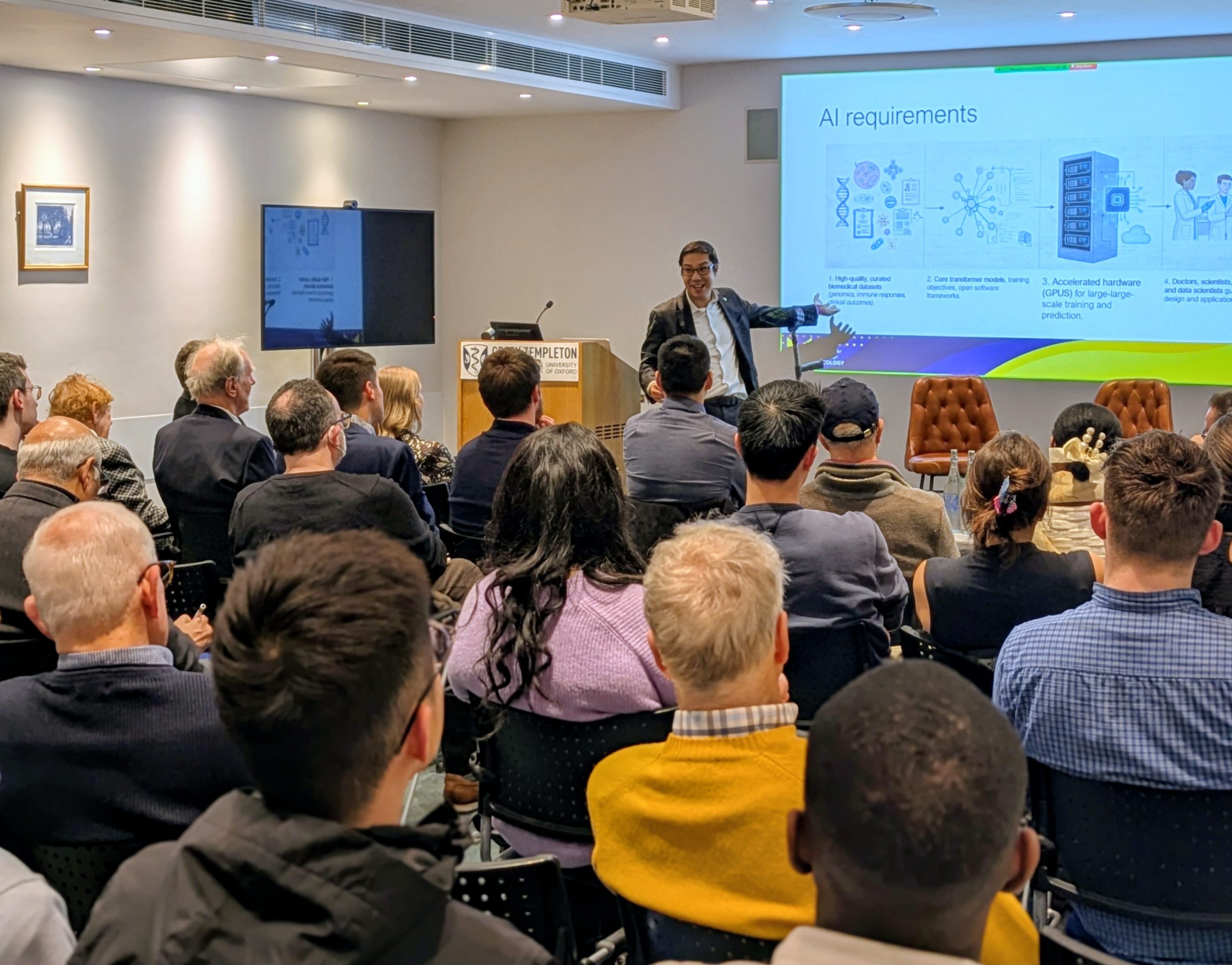 Lennard Lee gives a lecture in a crowded lecture theatre at Green Templeton College