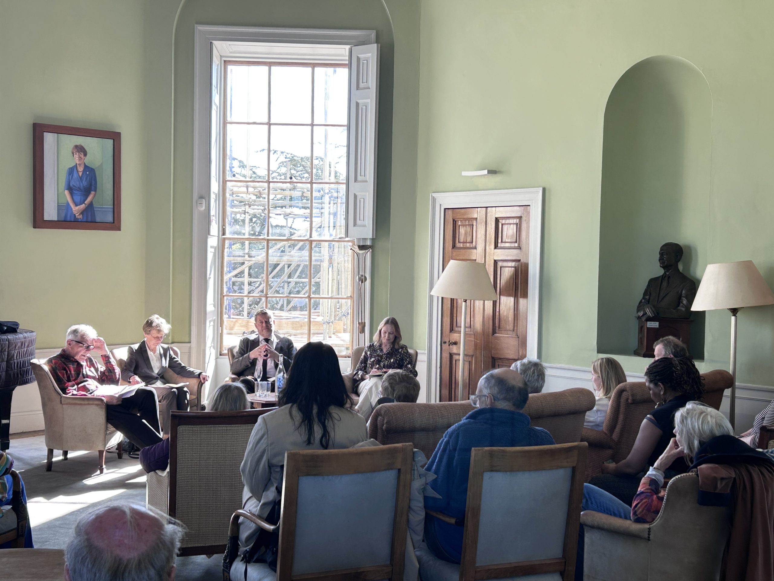 Guests listening to panel discussion in Observatory common room 