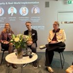 Five People Seated For Discussion With Slide Behind Entitled Ai Equity And Real World Implementation
