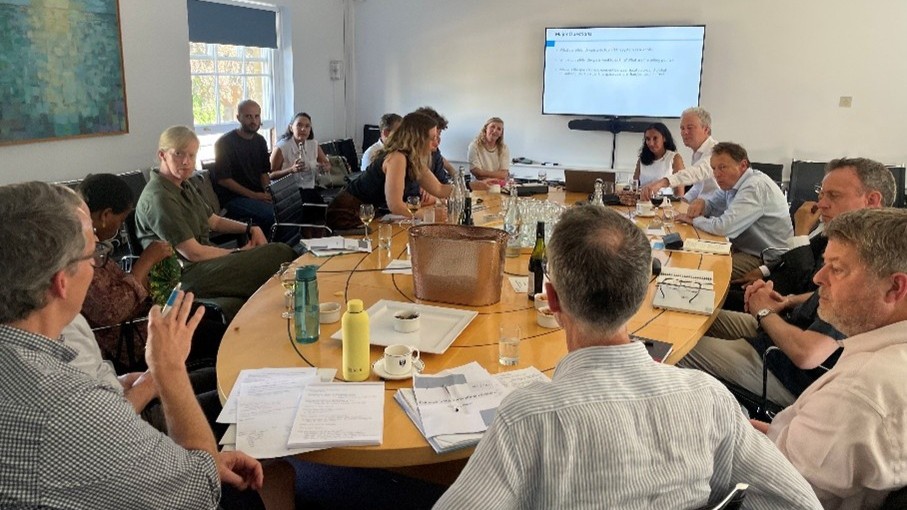 Philanthropy In The Humanitarian Sector round table discussion with screen behind