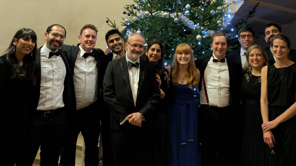 Doll Fellows And Some Of Wider Medical Teaching Team In Front Of The Christmas Tree In Formal Dress