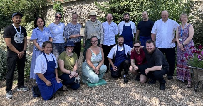 Team Working On Sustainability Across College Crop