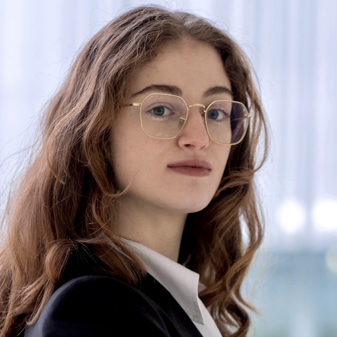 Beatrice Branciamore Profile Pic Wearing Jacket And Glasses